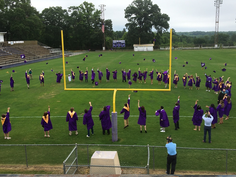 Senior Class of 2020 throw their graduation caps on WSHS football field